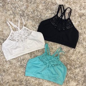 Set of three bralettes, black, white and turquoise. Brand new never worn. Medium